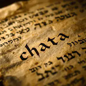 Close-up of an ancient Hebrew manuscript with the word "chata" highlighted.